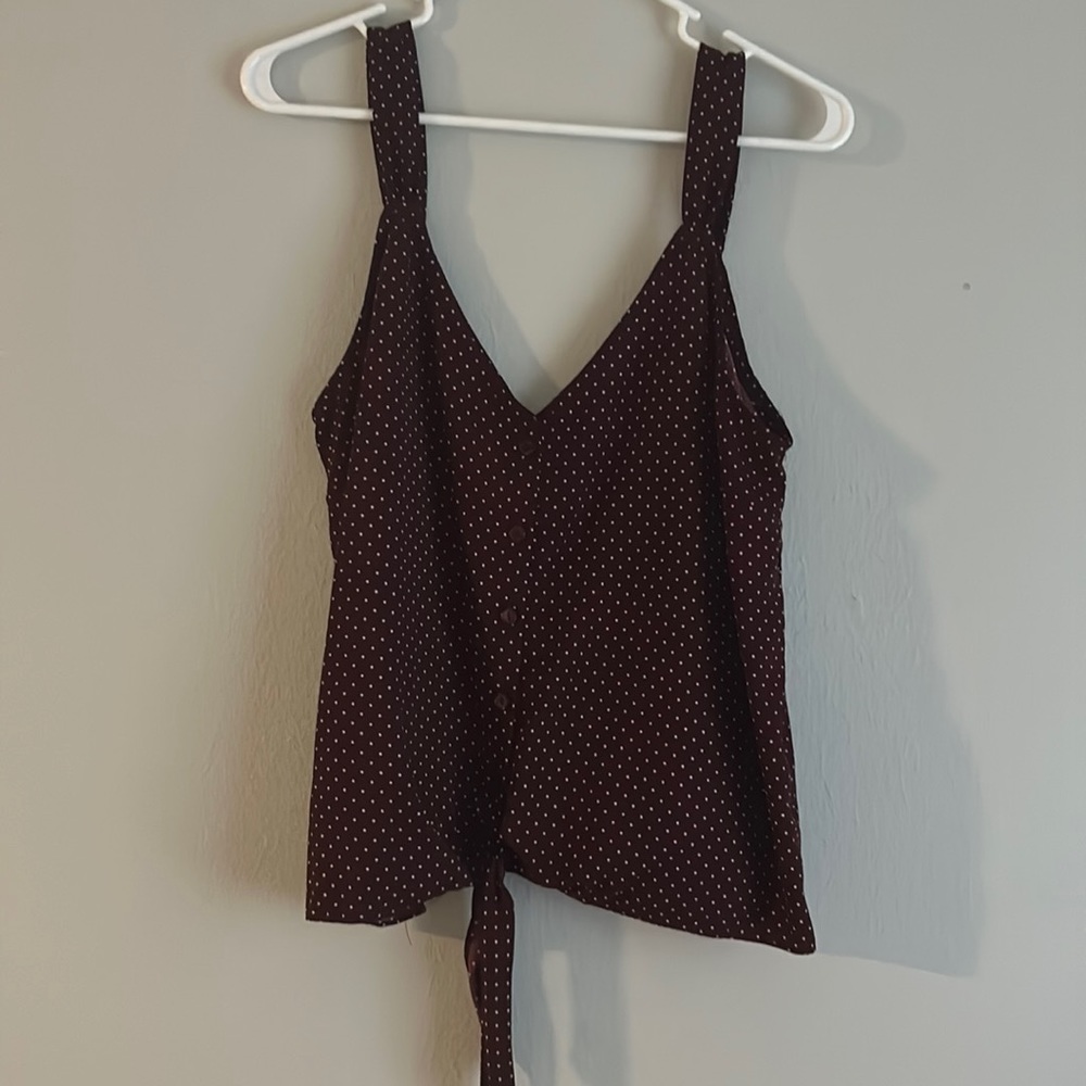 Garnet/maroon and white polka dotted tank with tie on the bottom